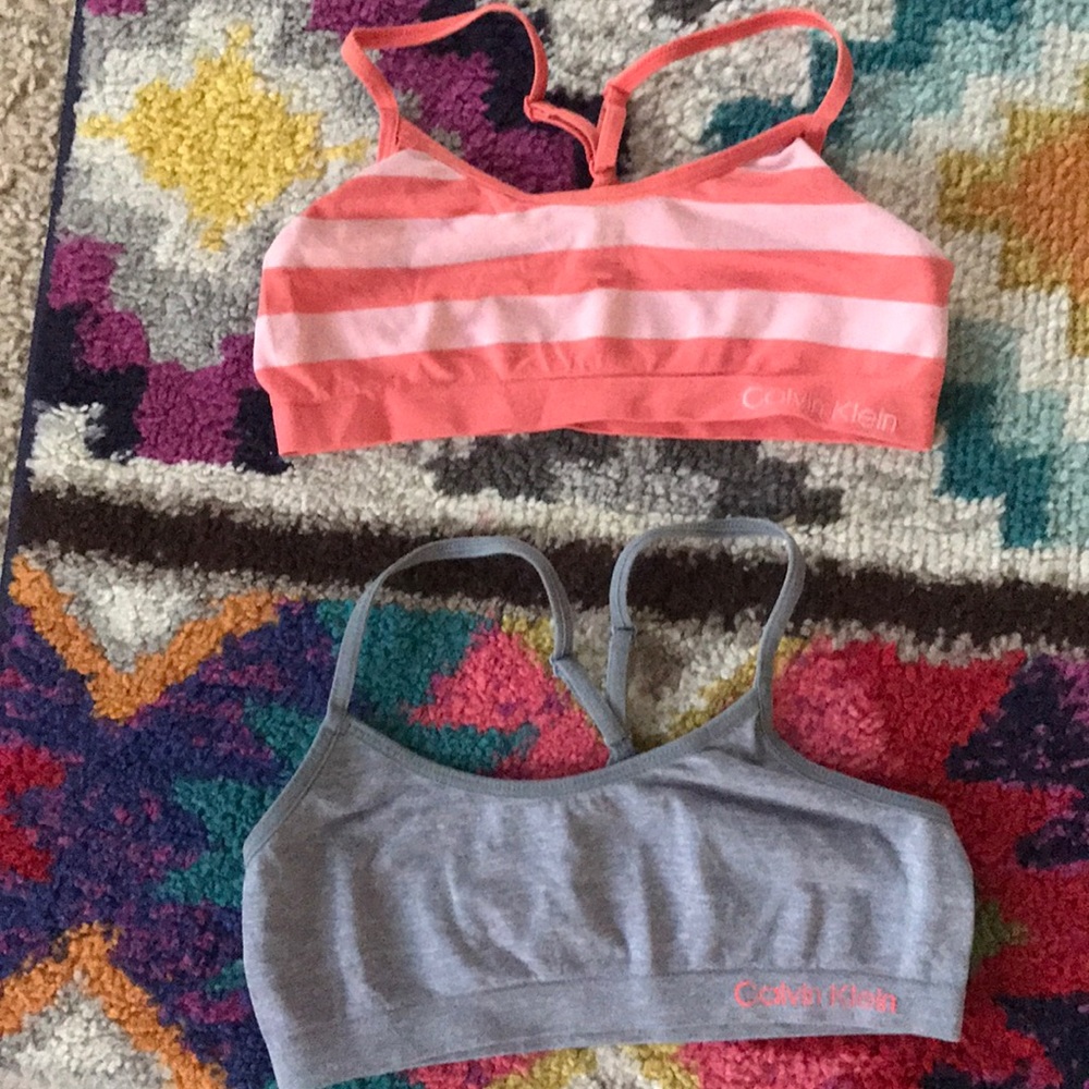 Two Calvin Klein sports bras